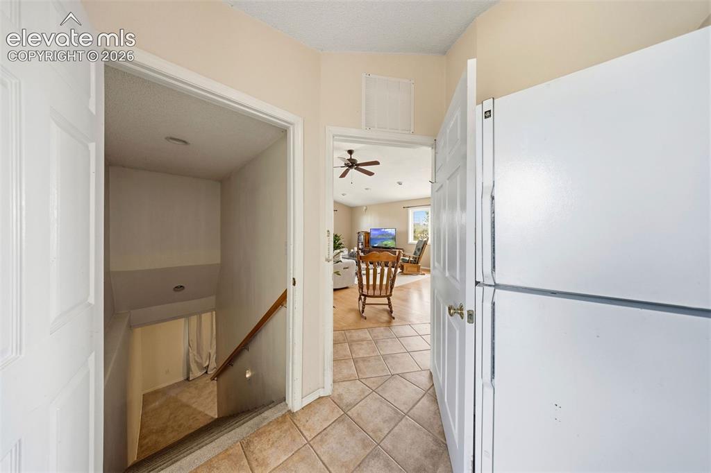 13075 Blaney Road South Peyton, CO 80831 - Photo 23 of 40 Entrance to basement featuring oversized stairs for easy moving.