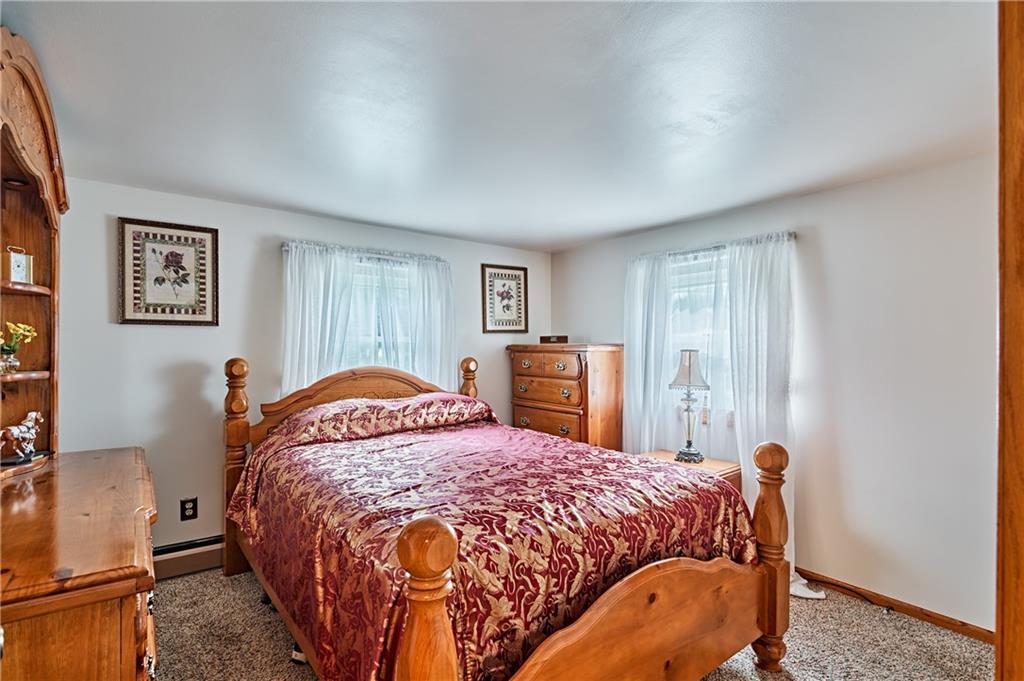 218 Evergreen Mill Road Harmony, PA 16037 - Photo 20 of 25 a bed sitting in a bedroom next to a window