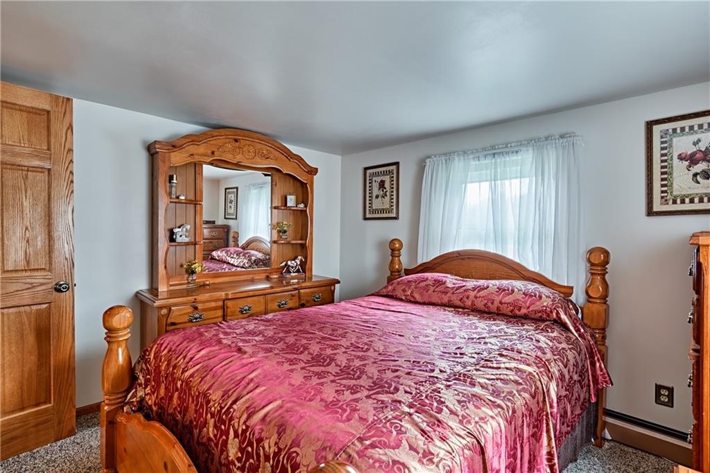 218 Evergreen Mill Road Harmony, PA 16037 - Photo 21 of 25 a bed sitting in a bedroom next to a window