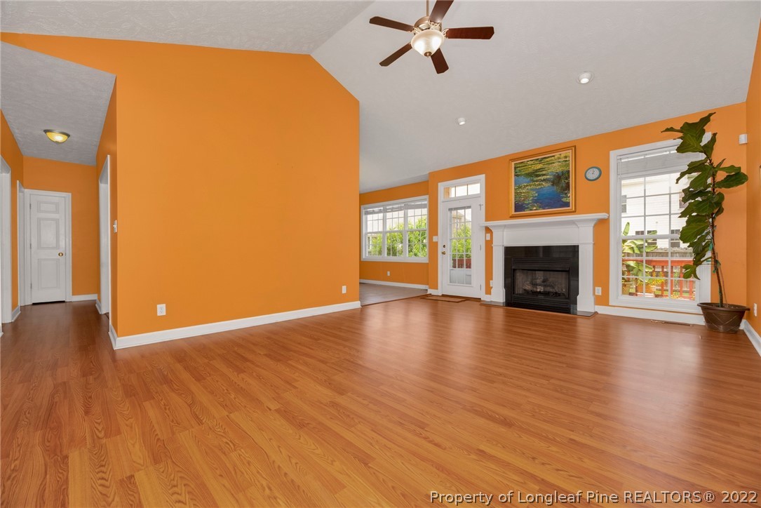 3540 Talus Road Fayetteville, NC 28306 - Photo 6 of 28 a view of an empty room with window and wooden floor