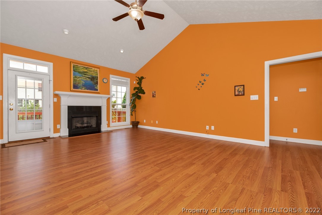 3540 Talus Road Fayetteville, NC 28306 - Photo 7 of 28 a view of a livingroom with wooden floor and a ceiling fan