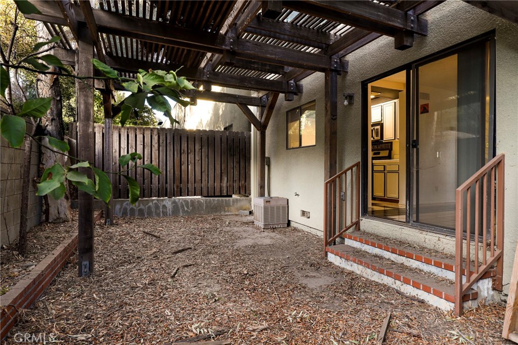 809 Temple Terrace Los Angeles, CA 90042 - Photo 33 of 46 a backyard of a house with table and chairs