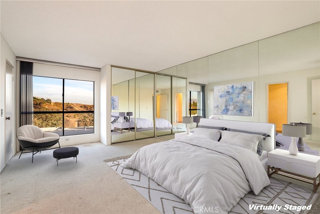 809 Temple Terrace Los Angeles, CA 90042 - Photo 9 of 46 a spacious bedroom with a bed and large window