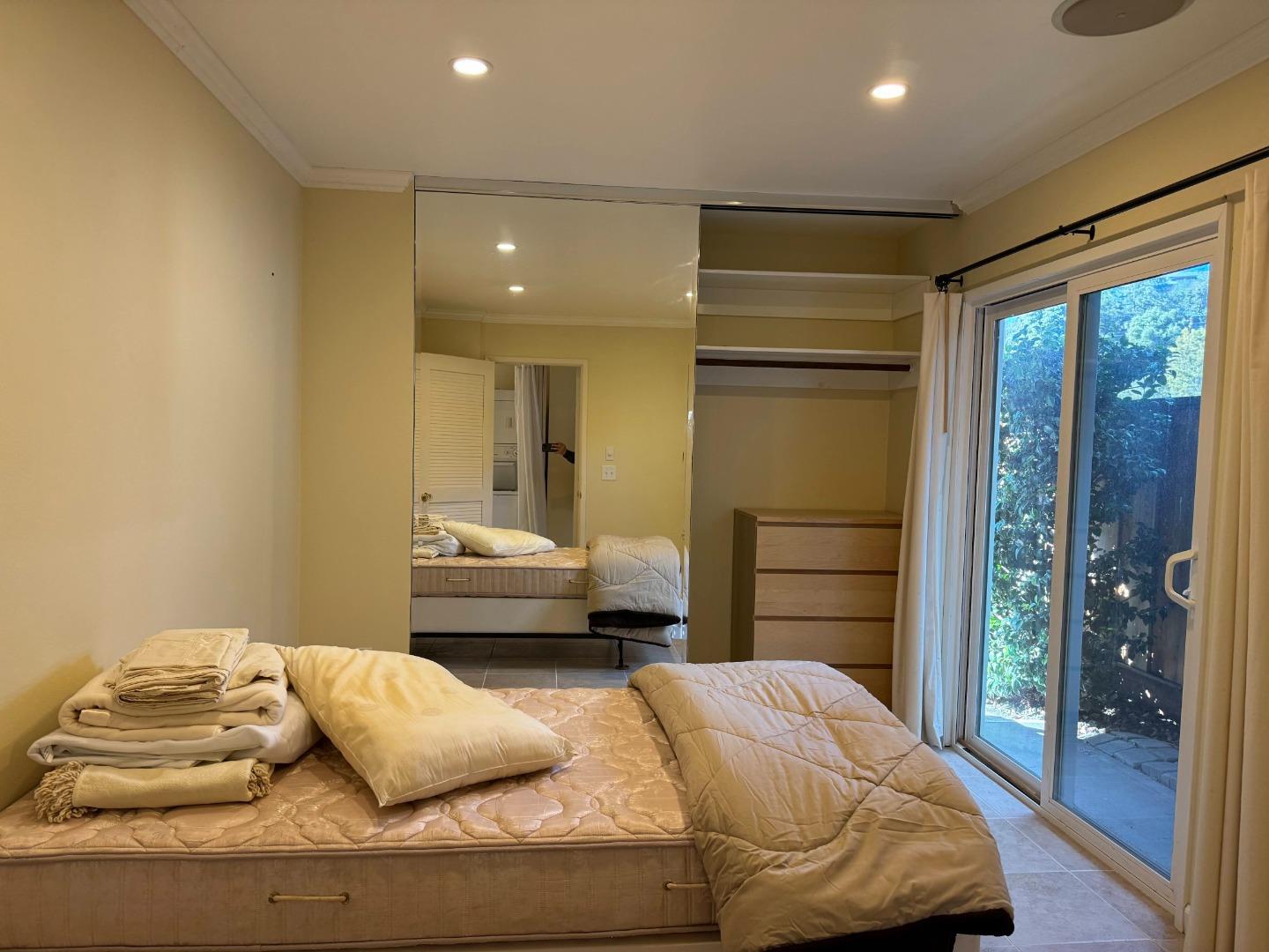 106 Winfield Way Aptos, CA 95003 - Photo 30 of 47 a bedroom with a bed and wooden floor