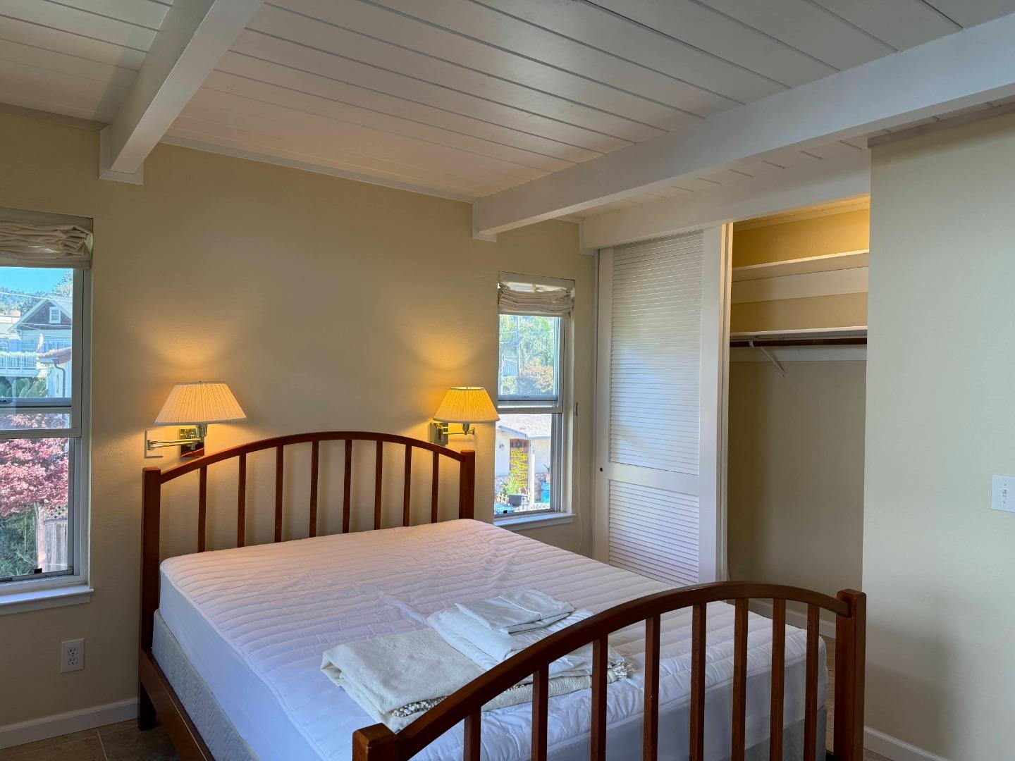 106 Winfield Way Aptos, CA 95003 - Photo 42 of 47 a bedroom with a bed and wooden floor