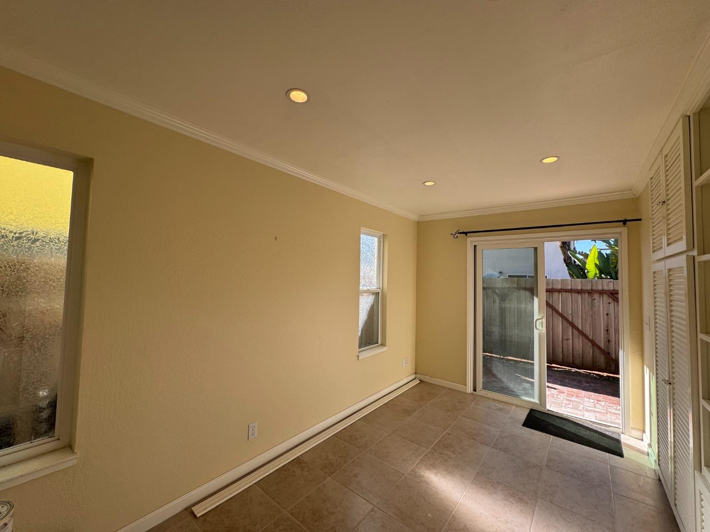 106 Winfield Way Aptos, CA 95003 - Photo 8 of 47 a view of an empty room with glass door