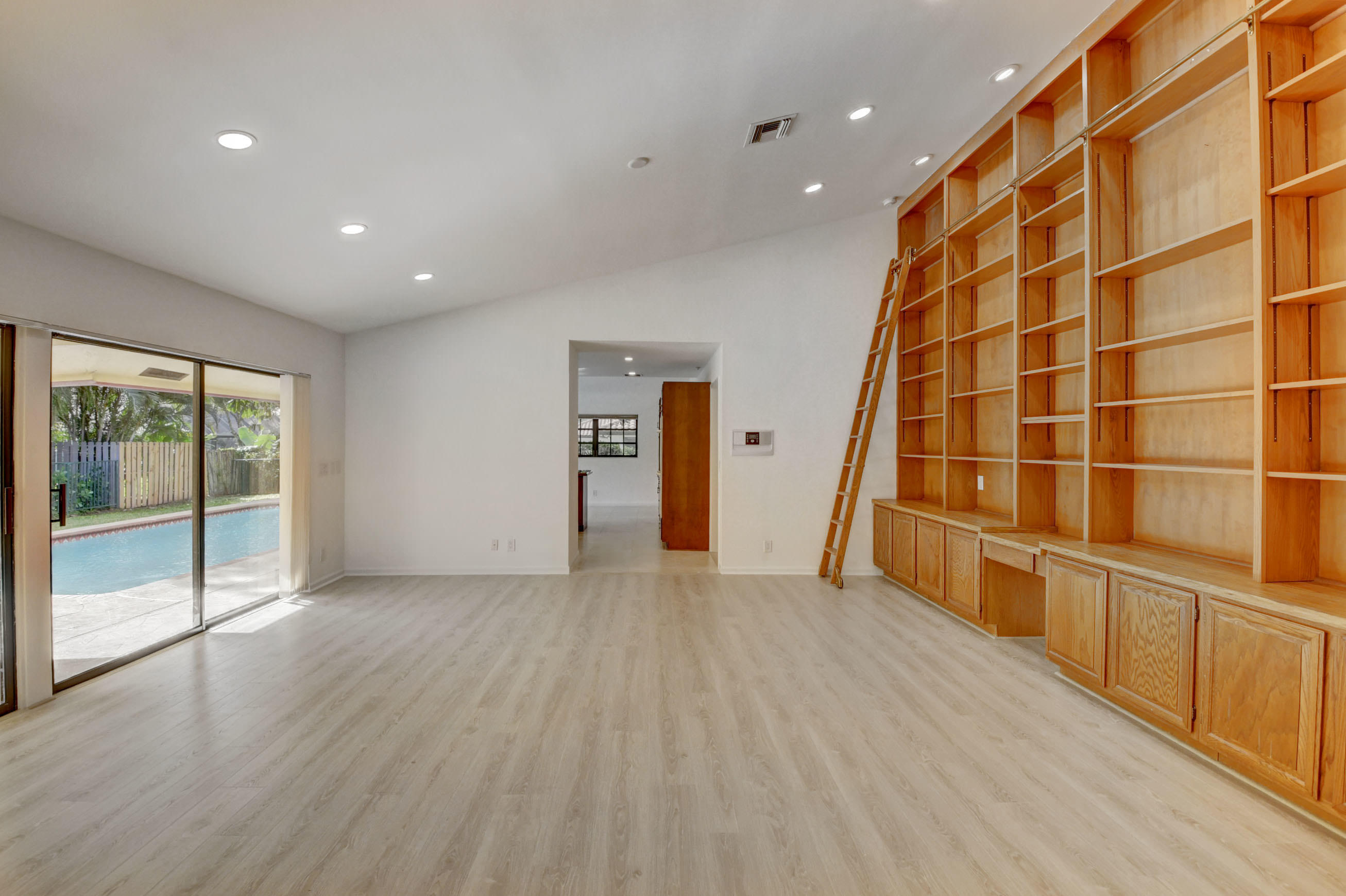 3230 St James Drive Boca Raton, FL 33434 - Photo 21 of 62 wooden floor in an empty room with a window