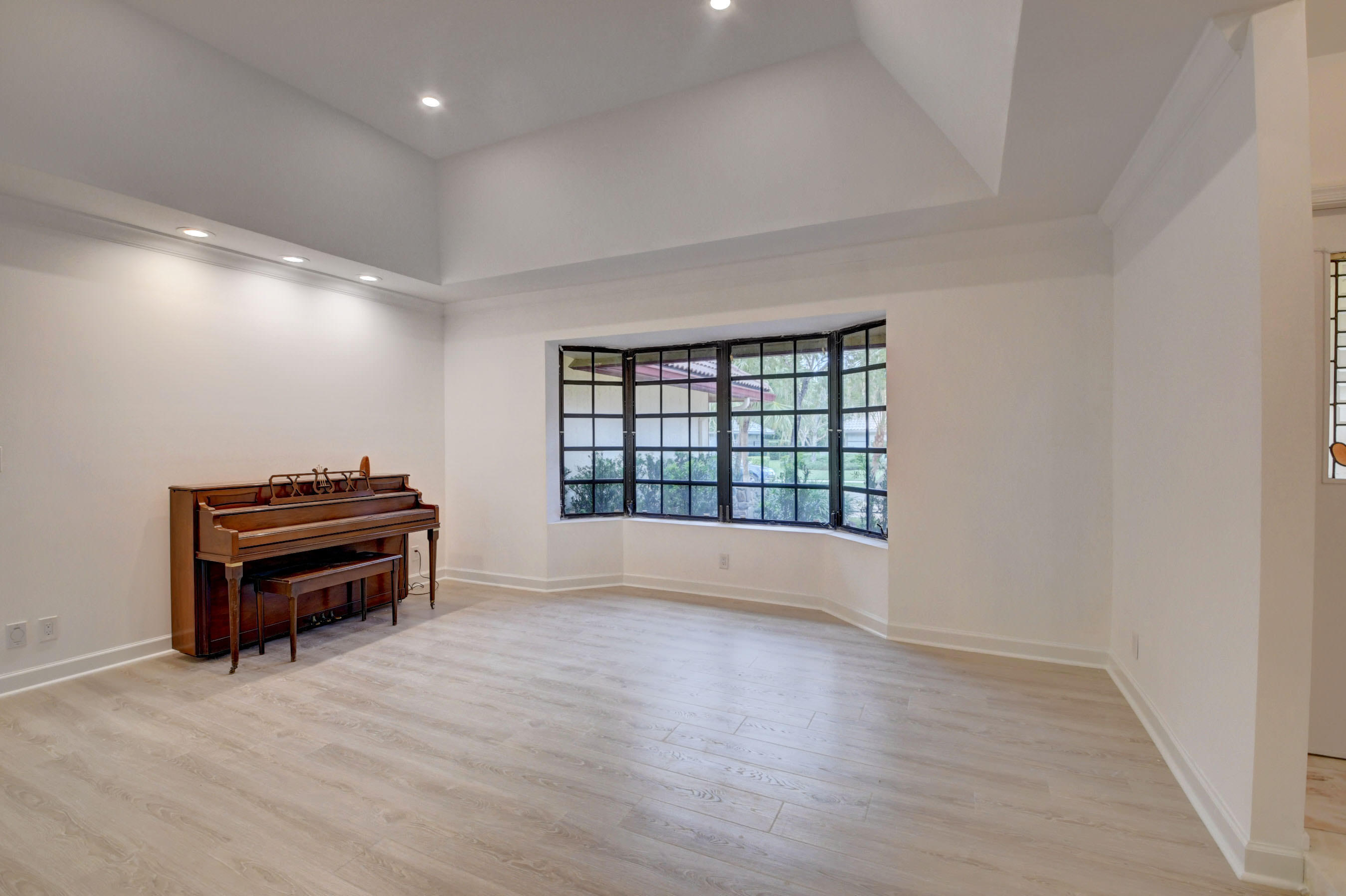3230 St James Drive Boca Raton, FL 33434 - Photo 26 of 62 wooden floor in an empty room with a window