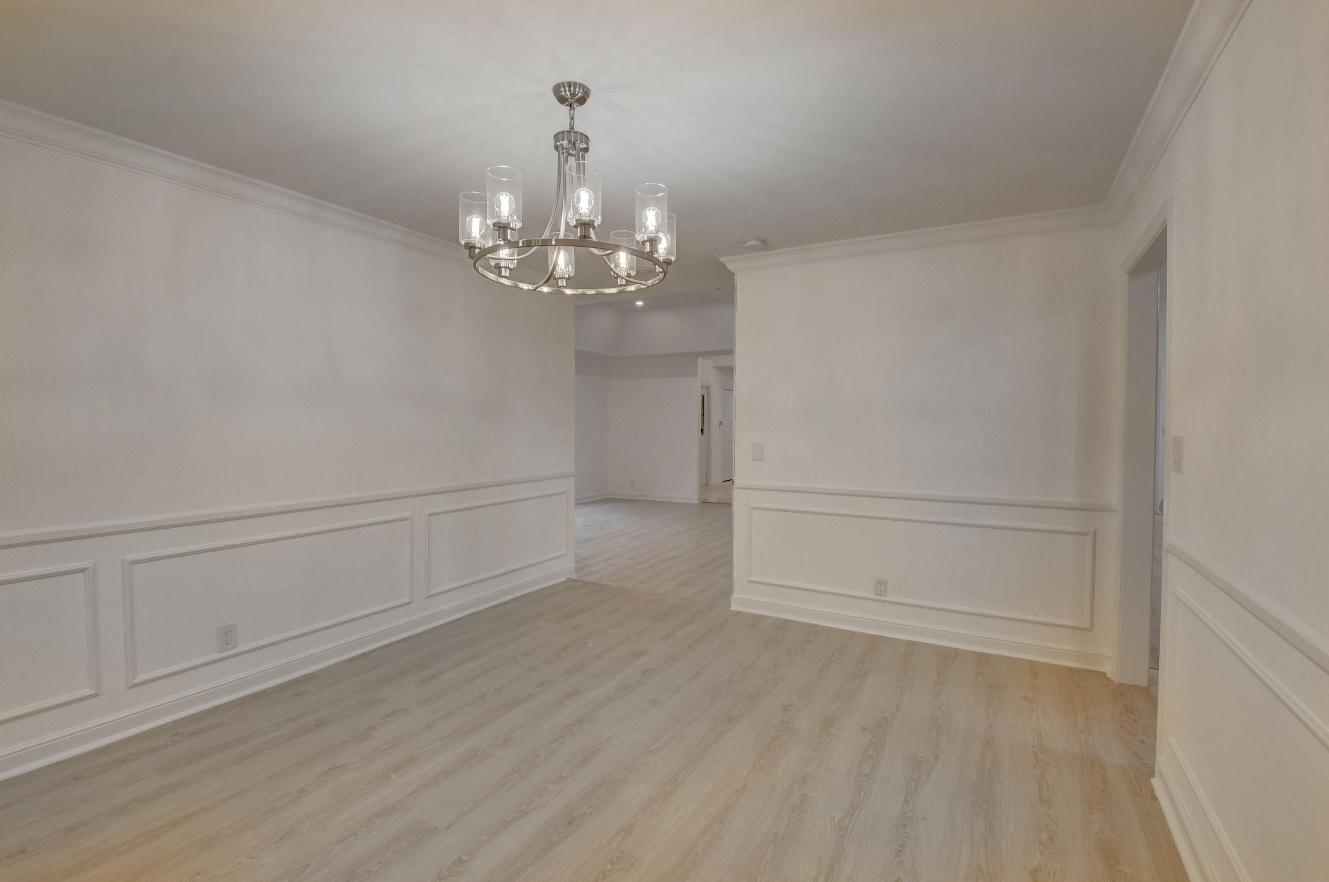 3230 St James Drive Boca Raton, FL 33434 - Photo 30 of 62 a view of a livingroom with an empty space & wooden floor