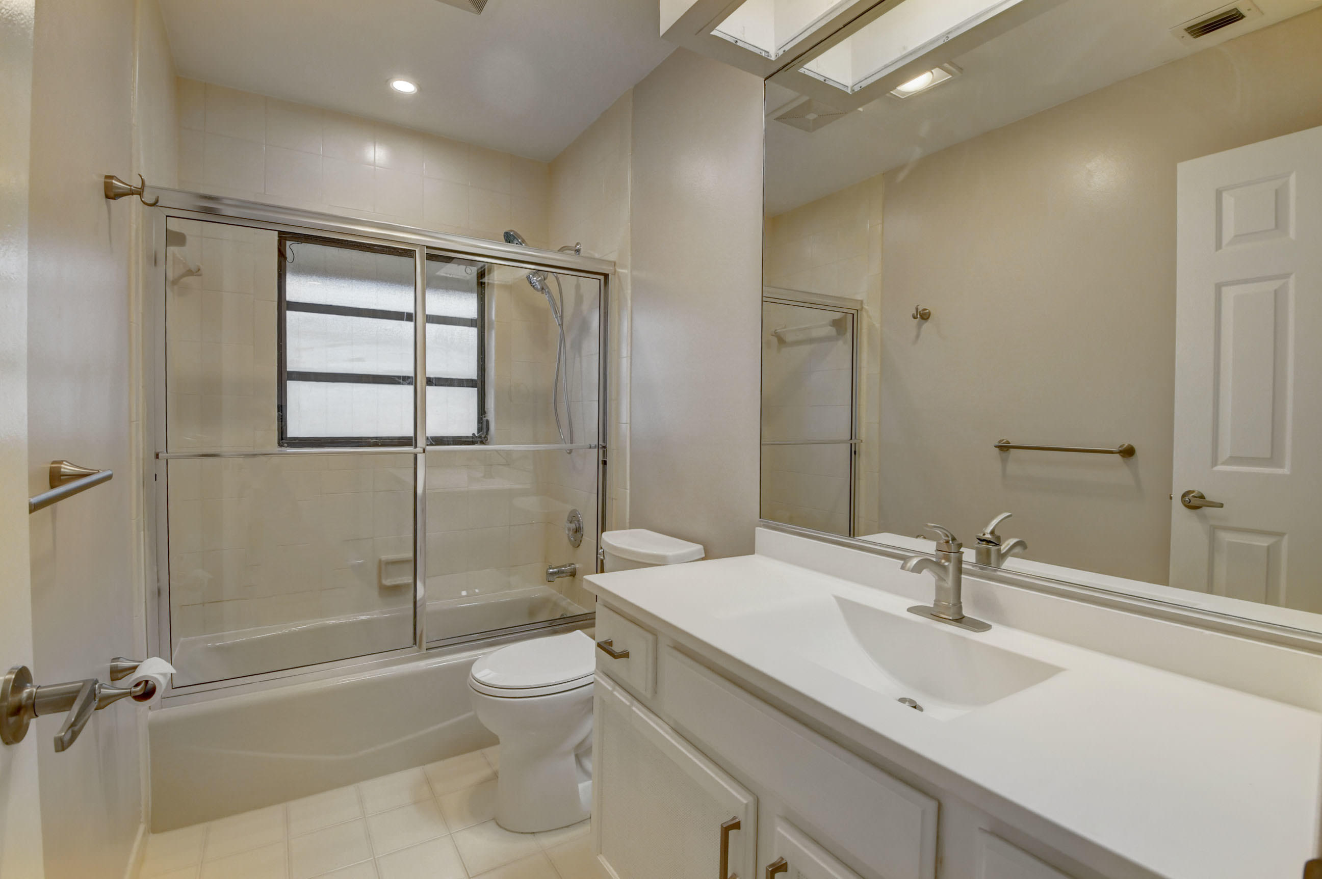 3230 St James Drive Boca Raton, FL 33434 - Photo 40 of 62 a bathroom with a sink toilet and shower