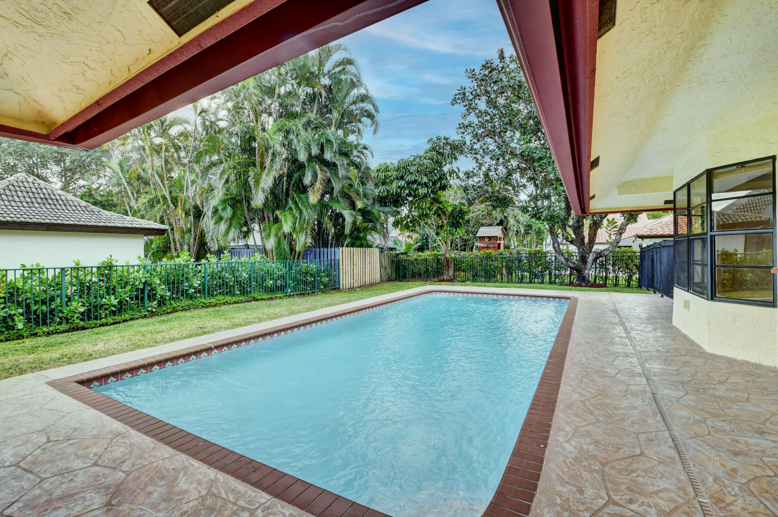 3230 St James Drive Boca Raton, FL 33434 - Photo 4 of 62 a view of swimming pool with a yard