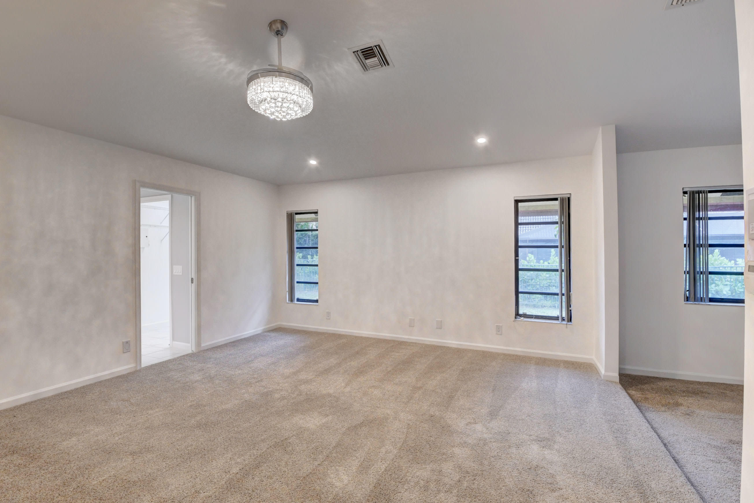 3230 St James Drive Boca Raton, FL 33434 - Photo 44 of 62 a view of an empty room with a window