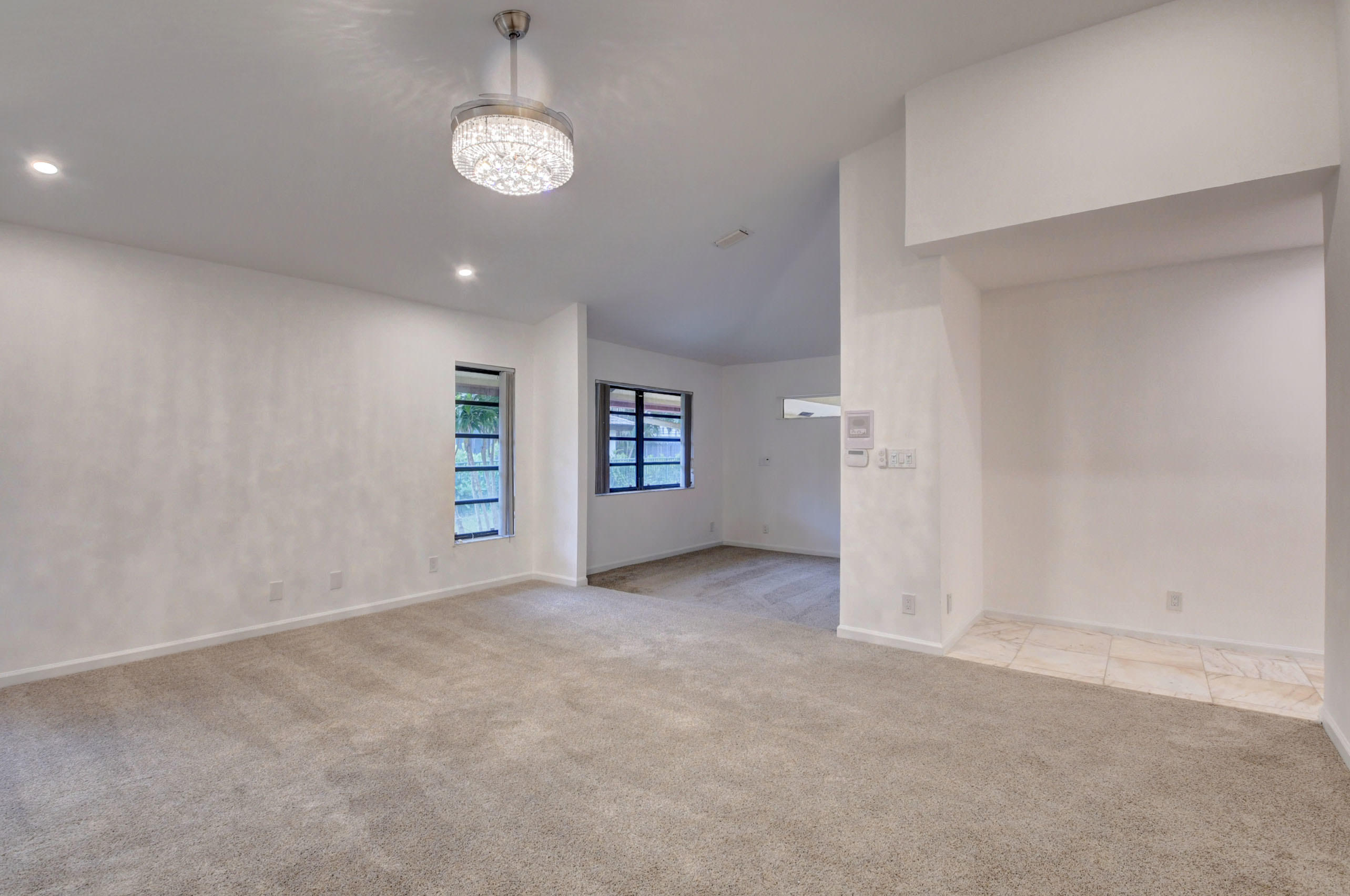 3230 St James Drive Boca Raton, FL 33434 - Photo 45 of 62 an empty room with closet and windows