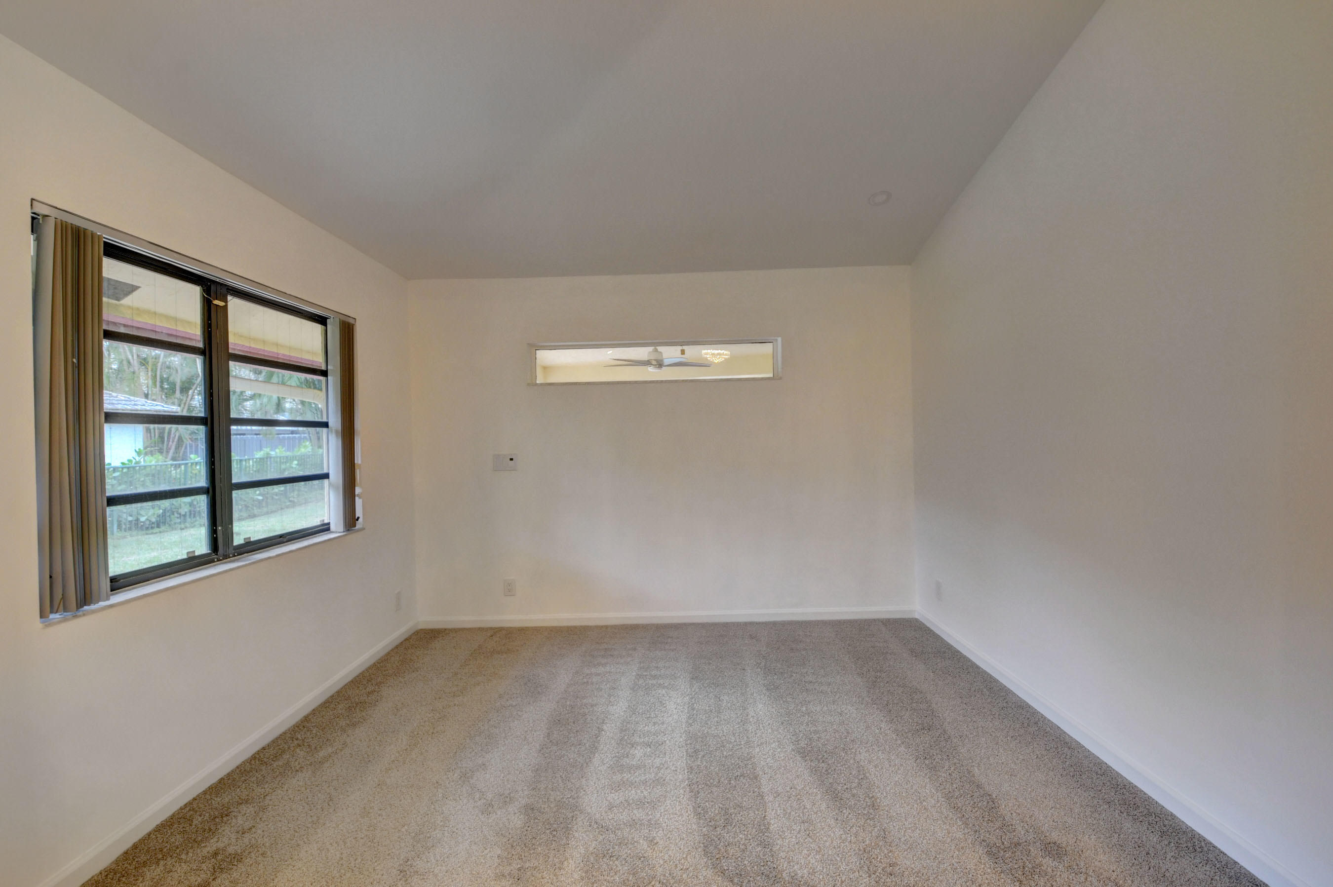 3230 St James Drive Boca Raton, FL 33434 - Photo 47 of 62 an empty room with a window