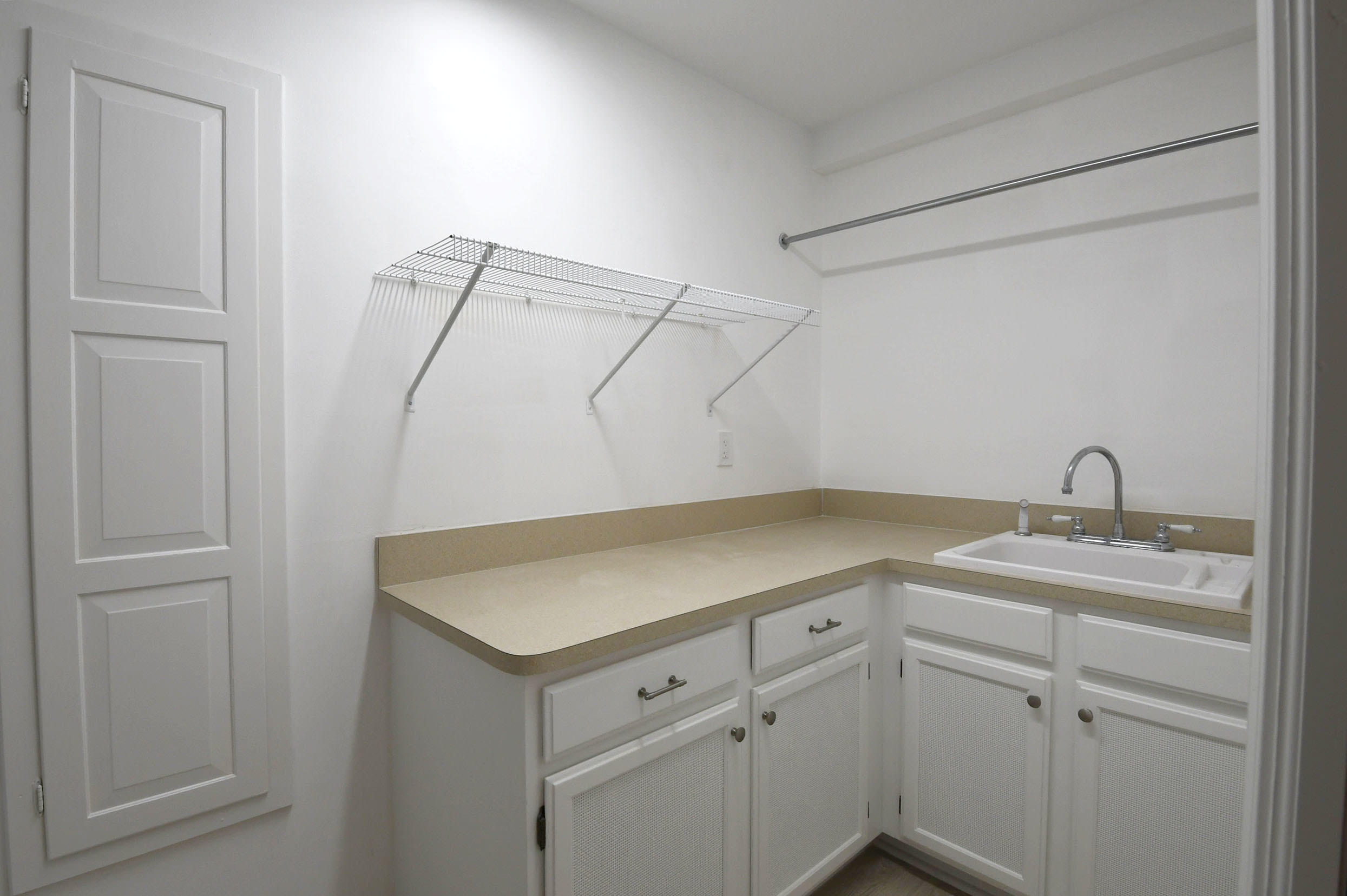 3230 St James Drive Boca Raton, FL 33434 - Photo 52 of 62 a room with a sink and cabinets