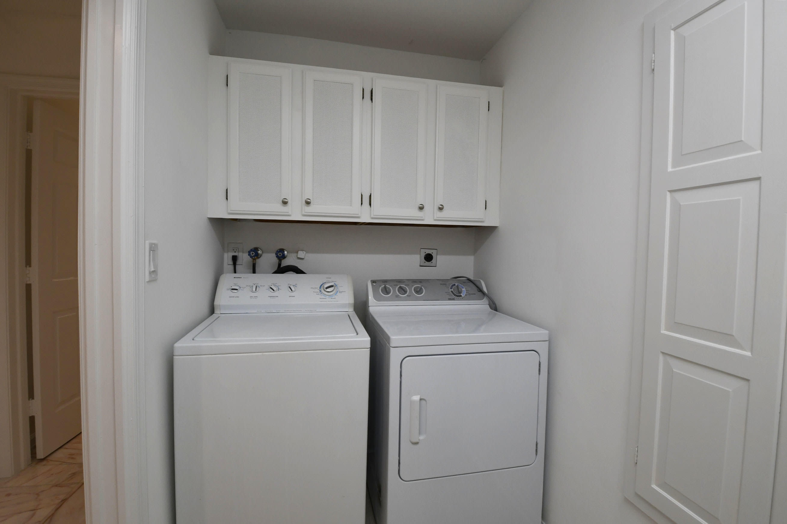 3230 St James Drive Boca Raton, FL 33434 - Photo 53 of 62 a view of storage and utility room with washer and dryer