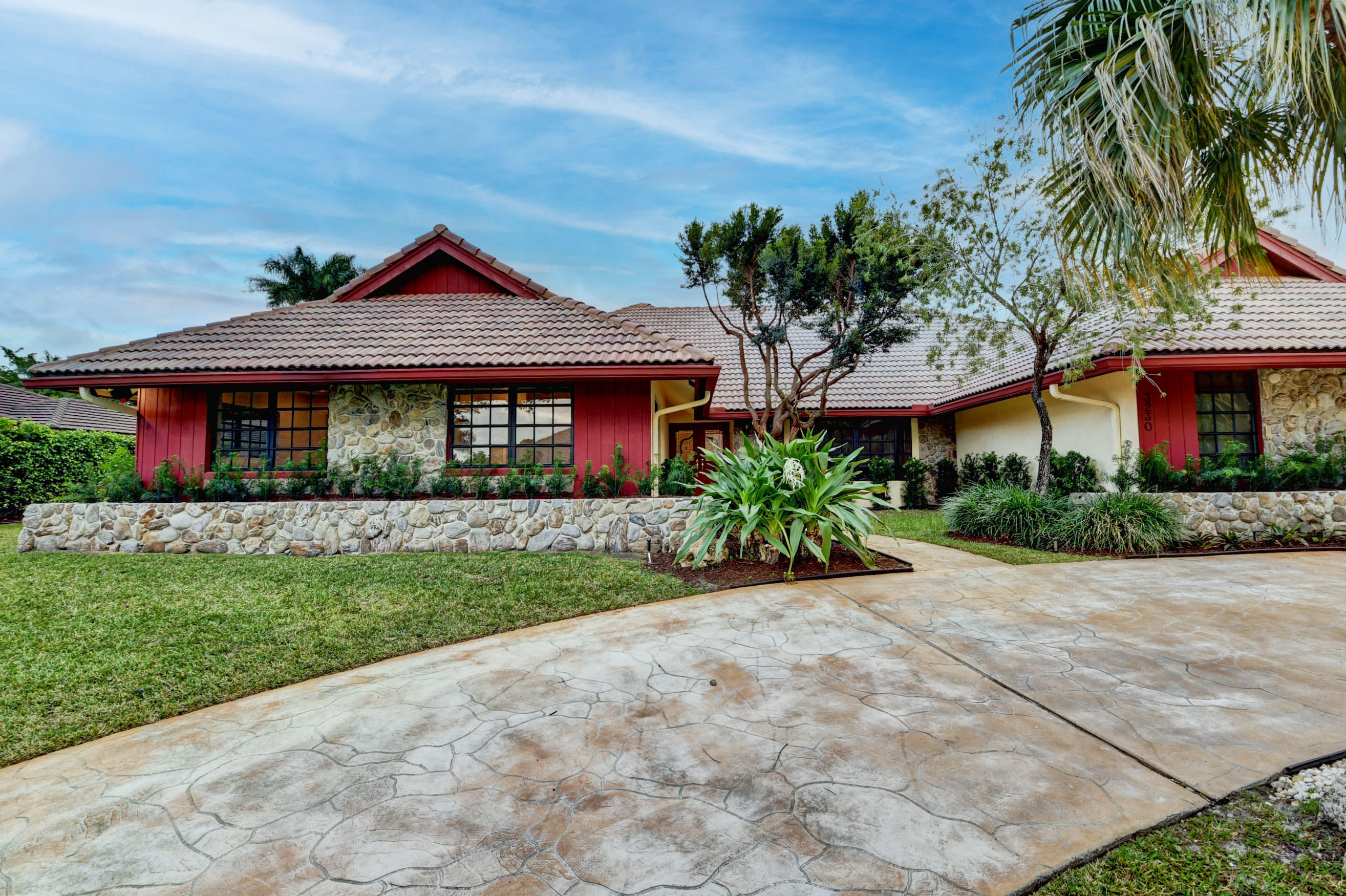 3230 St James Drive Boca Raton, FL 33434 - Photo 60 of 62 a front view of a house with a garden