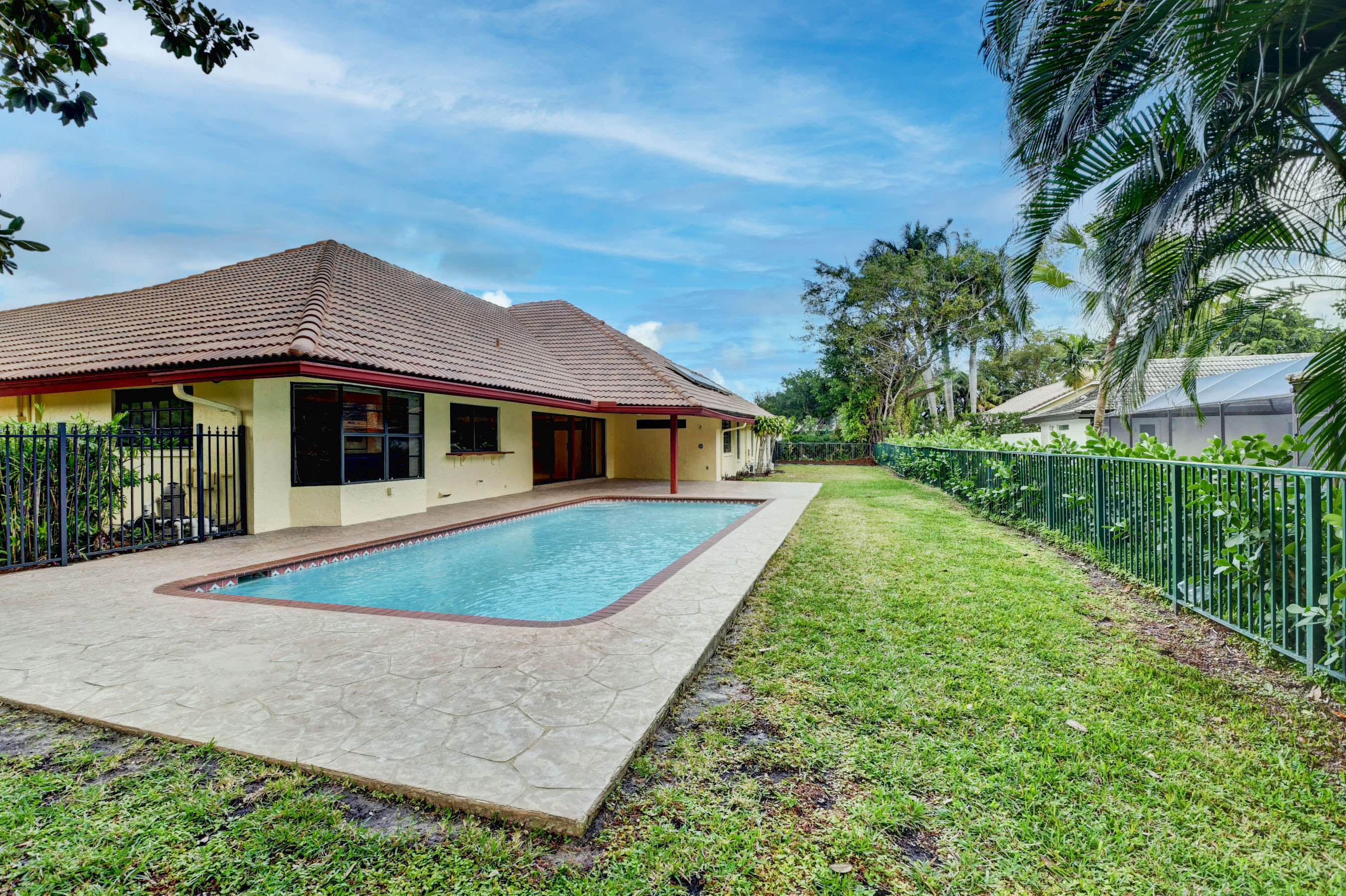 3230 St James Drive Boca Raton, FL 33434 - Photo 9 of 62 a front view of a house with a yard