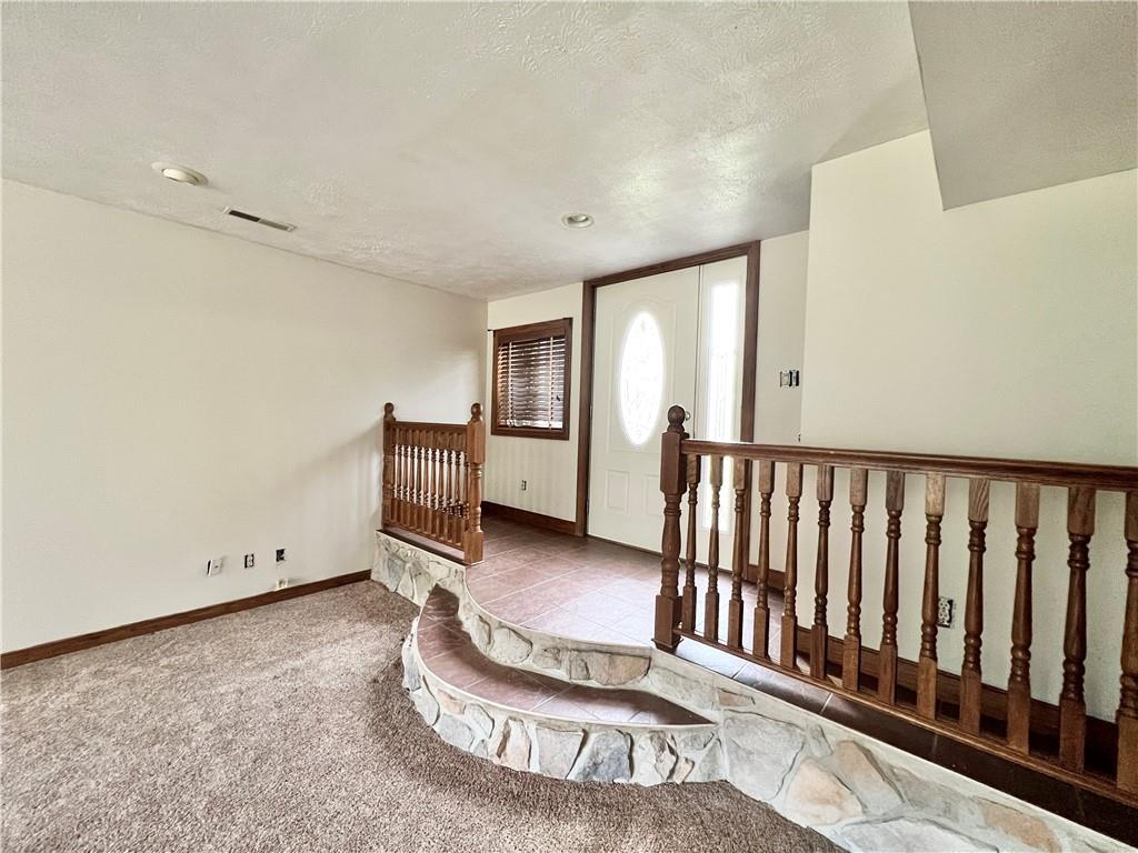 4293 Wampum Road New Castle, PA 16102 - Photo 4 of 16 a view of a hallway with staircase