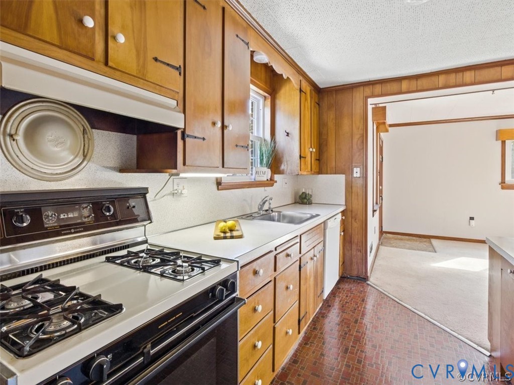 8719 Mapleton Road Henrico, VA 23229 - Photo 8 of 20 Kitchen featuring wood-finish cabinetry, built-in