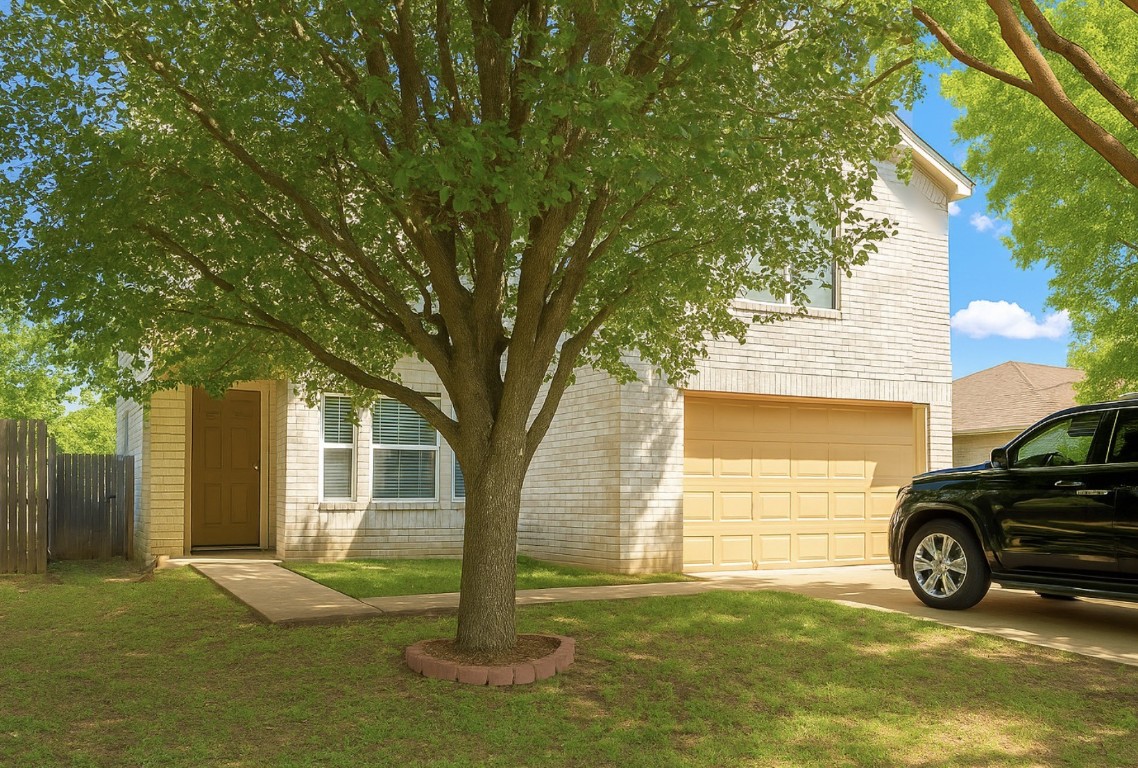 a view of a car in front of a house