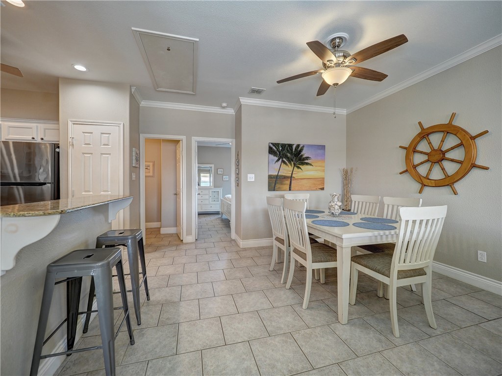 1833 Eleventh Street, Unit F2 Port Aransas, TX 78373 - Photo 11 of 40 a view of a dining room with furniture