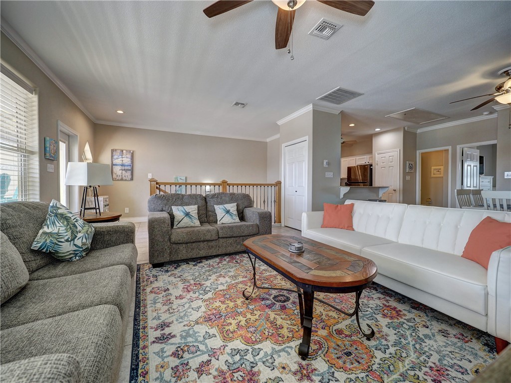 1833 Eleventh Street, Unit F2 Port Aransas, TX 78373 - Photo 16 of 40 a living room with furniture and a view of kitchen