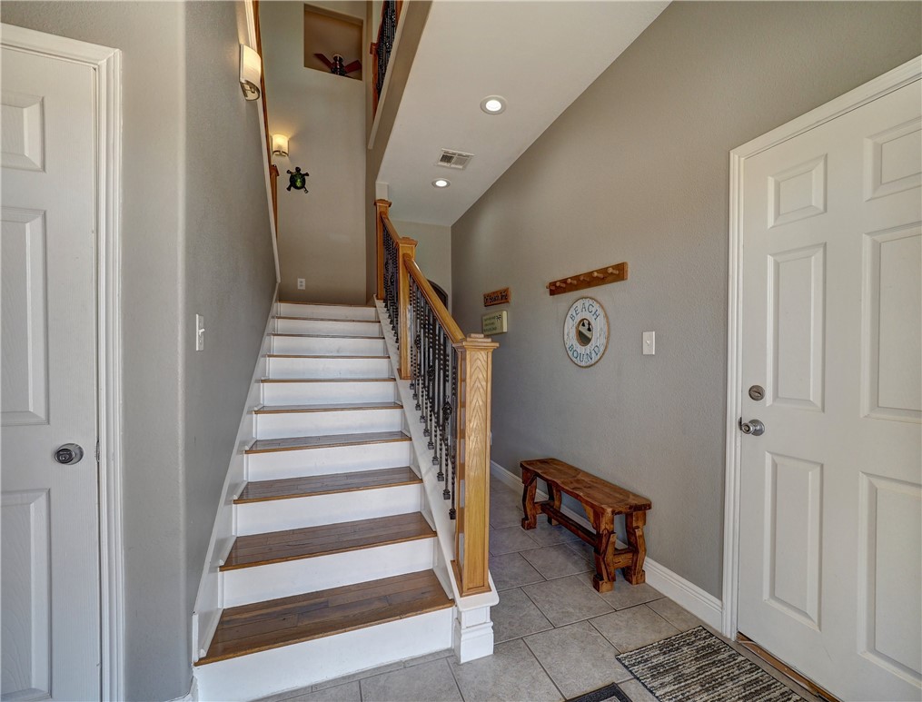 1833 Eleventh Street, Unit F2 Port Aransas, TX 78373 - Photo 28 of 40 a view of entryway with stairs and a rug