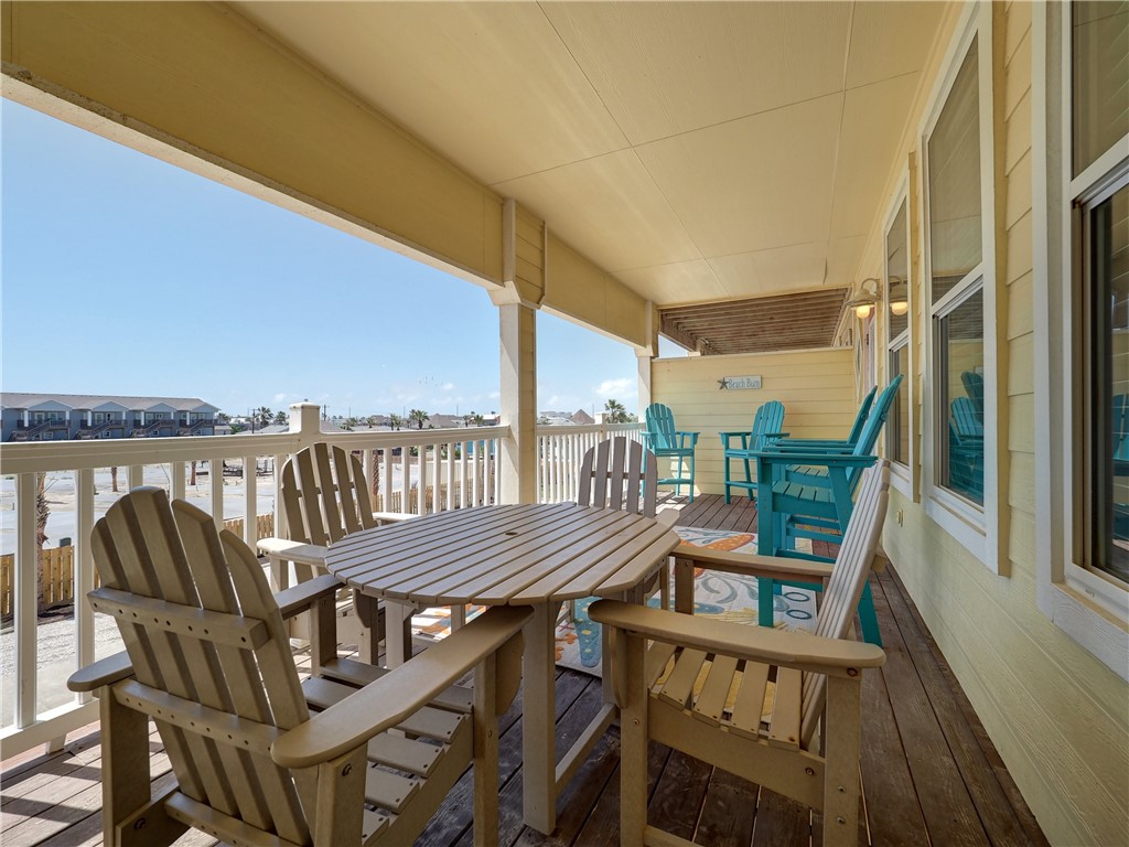 1833 Eleventh Street, Unit F2 Port Aransas, TX 78373 - Photo 33 of 40 a view of a balcony with furniture