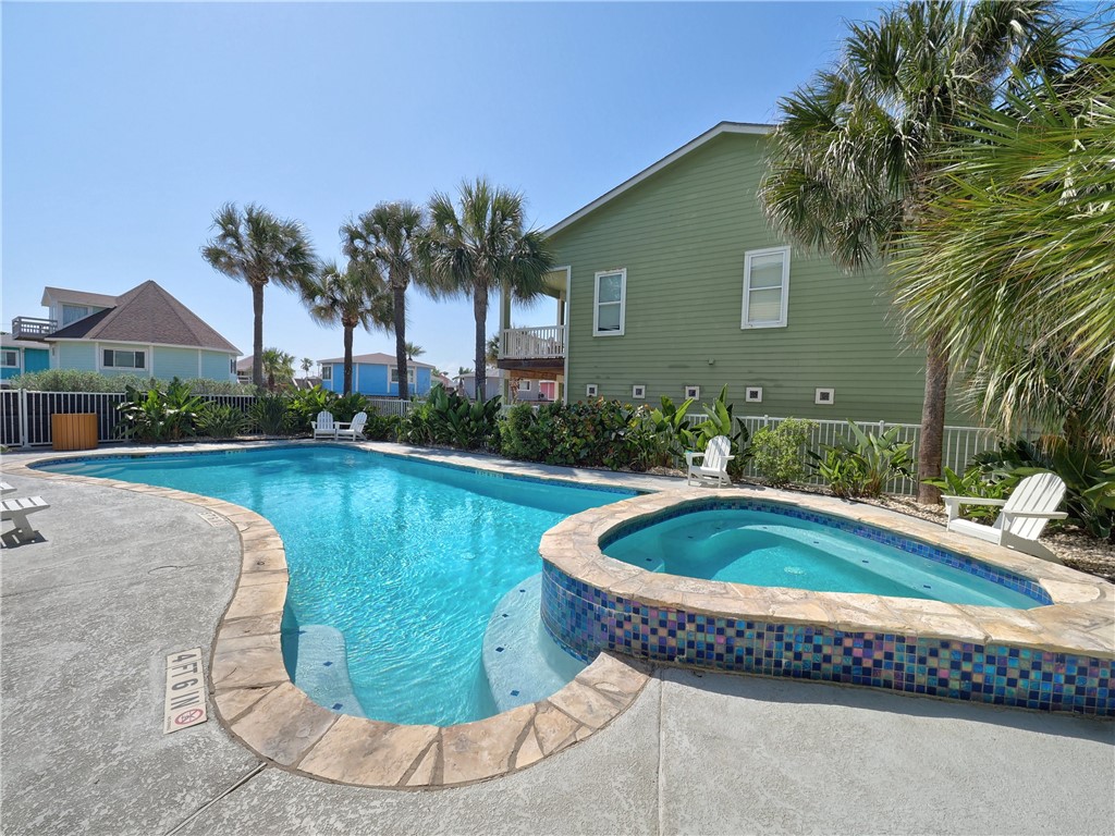 1833 Eleventh Street, Unit F2 Port Aransas, TX 78373 - Photo 34 of 40 a view of a swimming pool with a patio