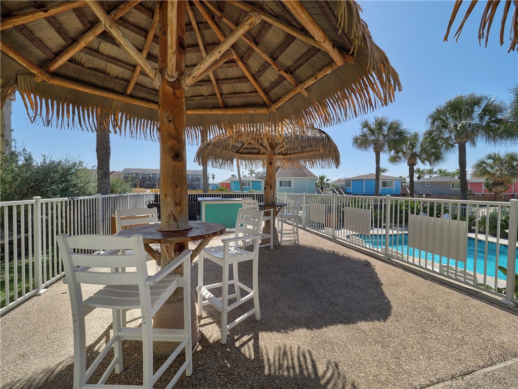 1833 Eleventh Street, Unit F2 Port Aransas, TX 78373 - Photo 35 of 40 a view of a patio with iron fence