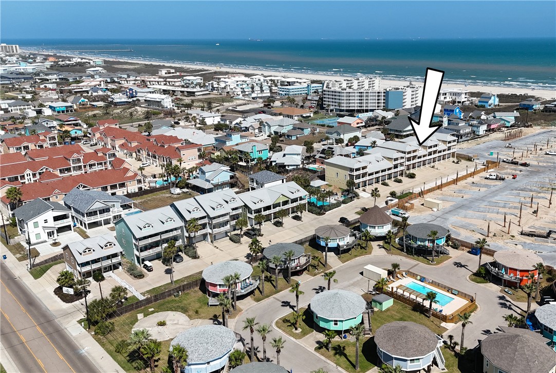1833 Eleventh Street, Unit F2 Port Aransas, TX 78373 - Photo 36 of 40 an aerial view of residential houses with outdoor space