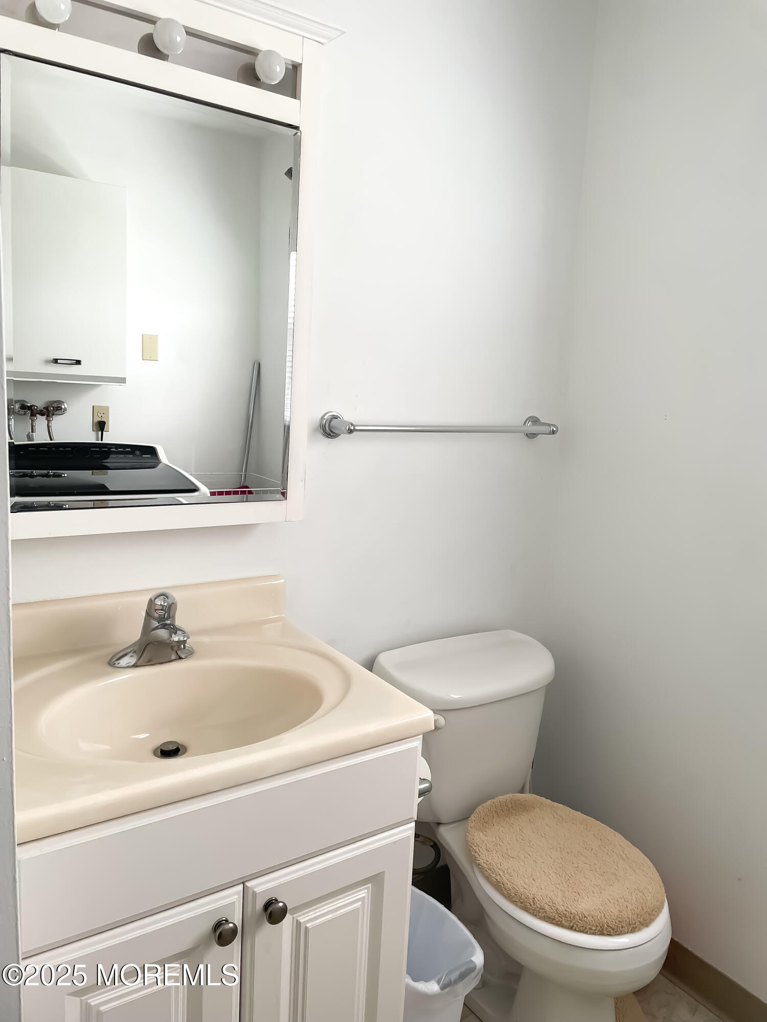 4 Churchill Road, Unit 71 Manchester Township, NJ 08759 - Photo 6 of 12 a white toilet sitting next to a bathroom sink