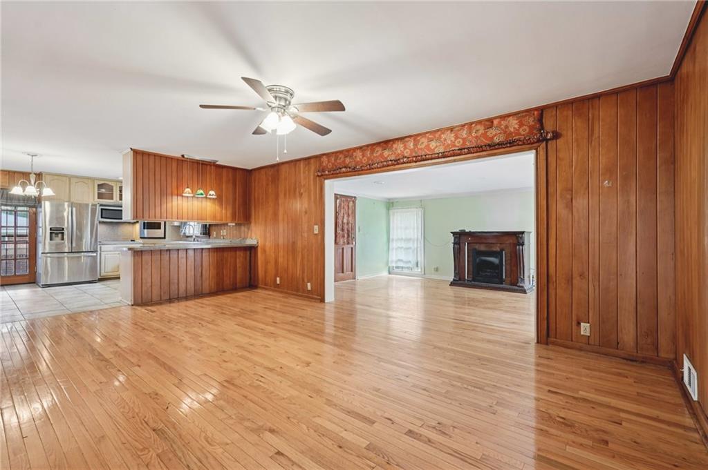 3407 West Manor Lane Southwest Atlanta, GA 30311 - Photo 15 of 36 a view of a kitchen with wooden floor and a kitchen space