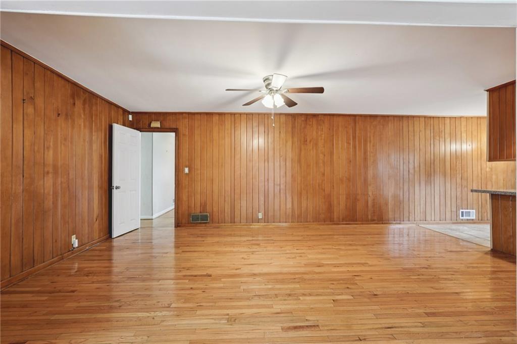 3407 West Manor Lane Southwest Atlanta, GA 30311 - Photo 16 of 36 a view of empty room with wooden floor