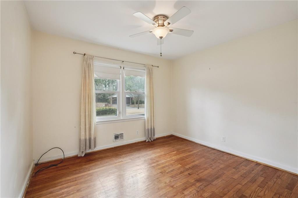 3407 West Manor Lane Southwest Atlanta, GA 30311 - Photo 22 of 36 a view of an empty room with a window