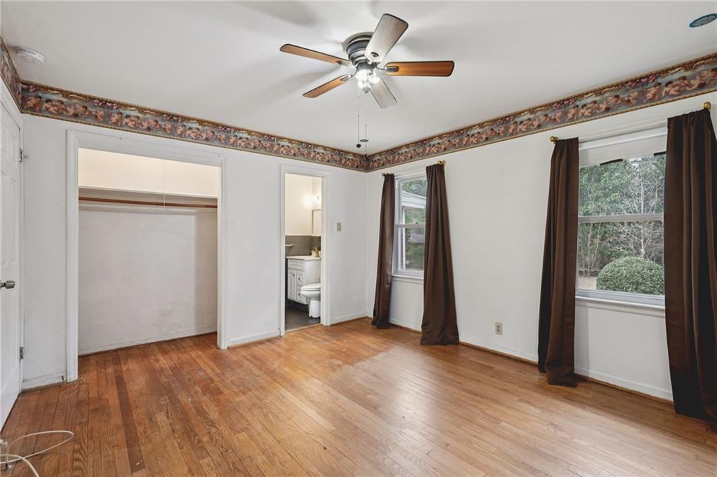 3407 West Manor Lane Southwest Atlanta, GA 30311 - Photo 29 of 36 a view of a livingroom with a ceiling fan and window