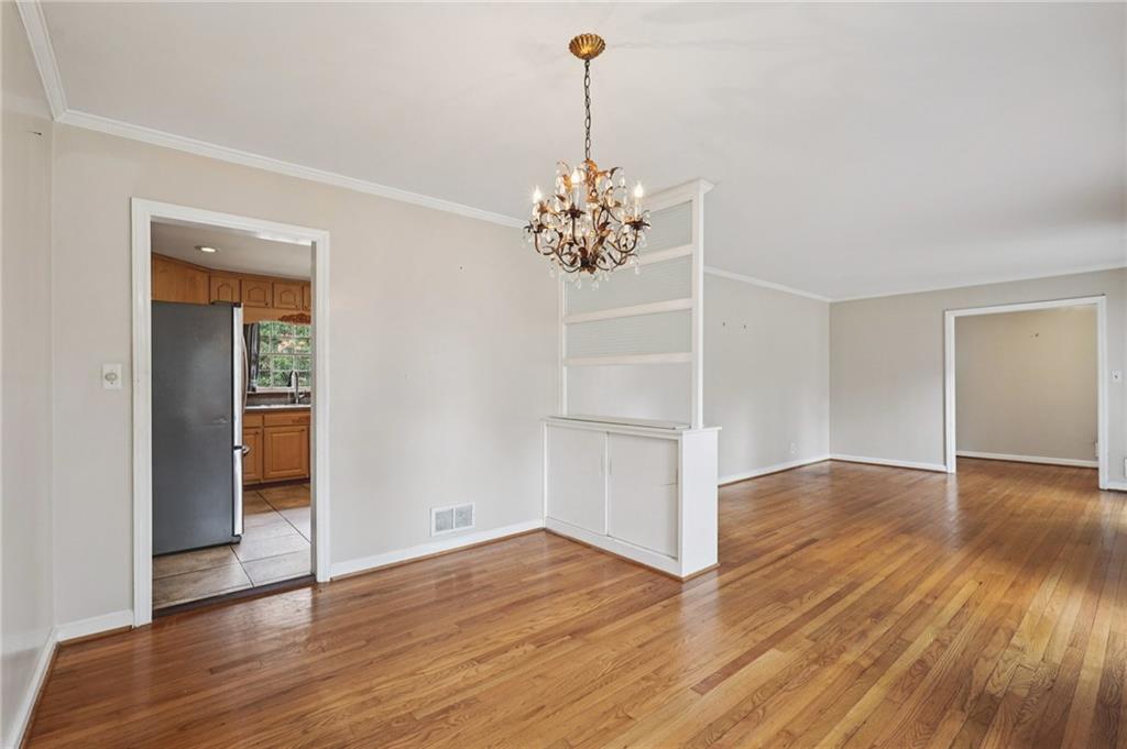 3407 West Manor Lane Southwest Atlanta, GA 30311 - Photo 3 of 36 a view of empty room with wooden floor