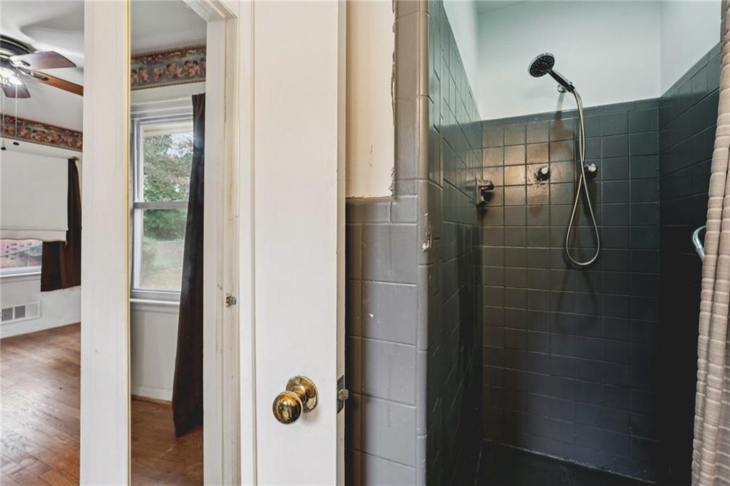 3407 West Manor Lane Southwest Atlanta, GA 30311 - Photo 31 of 36 a bathroom with a shower