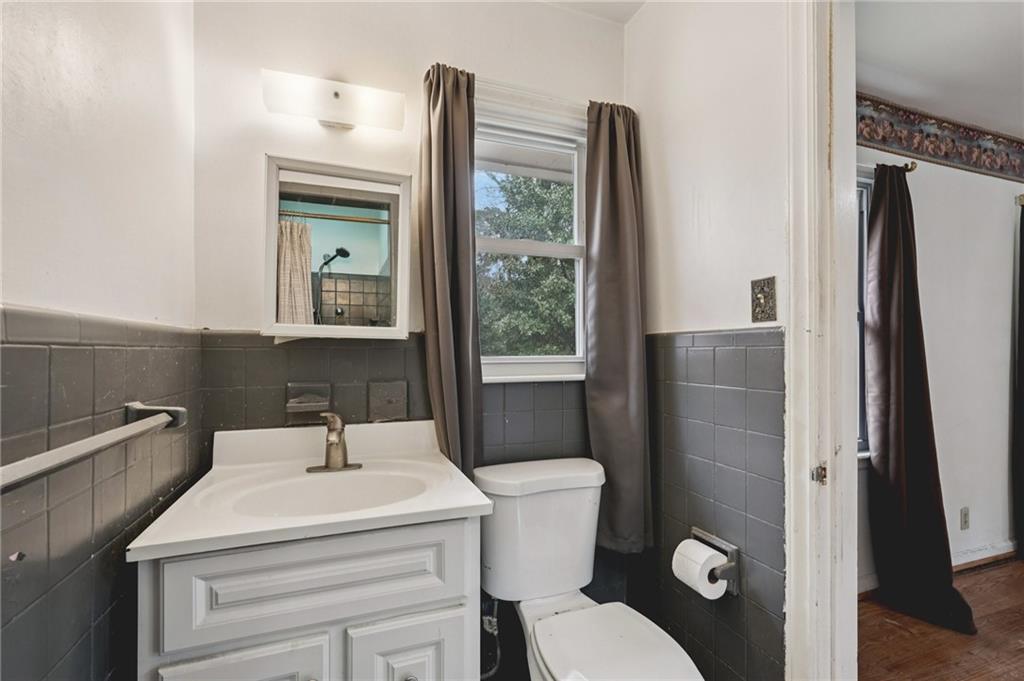 3407 West Manor Lane Southwest Atlanta, GA 30311 - Photo 32 of 36 a bathroom with a sink toilet and shower
