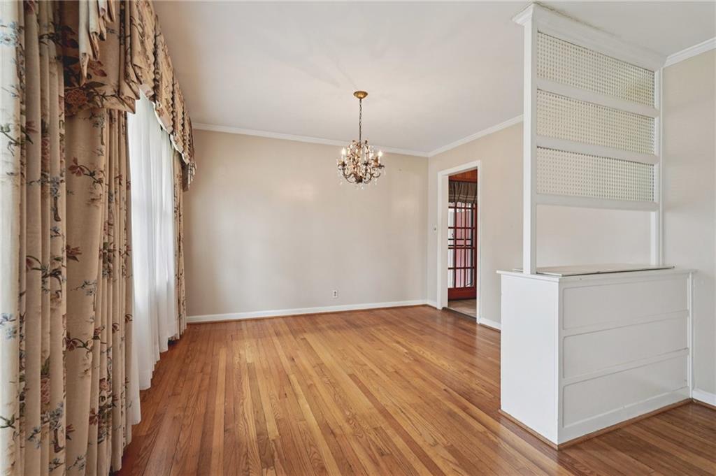 3407 West Manor Lane Southwest Atlanta, GA 30311 - Photo 5 of 36 a view of a hallway with wooden floor and staircase
