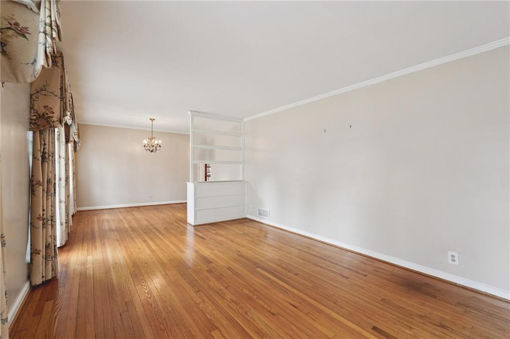 3407 West Manor Lane Southwest Atlanta, GA 30311 - Photo 7 of 36 wooden floor in an empty room