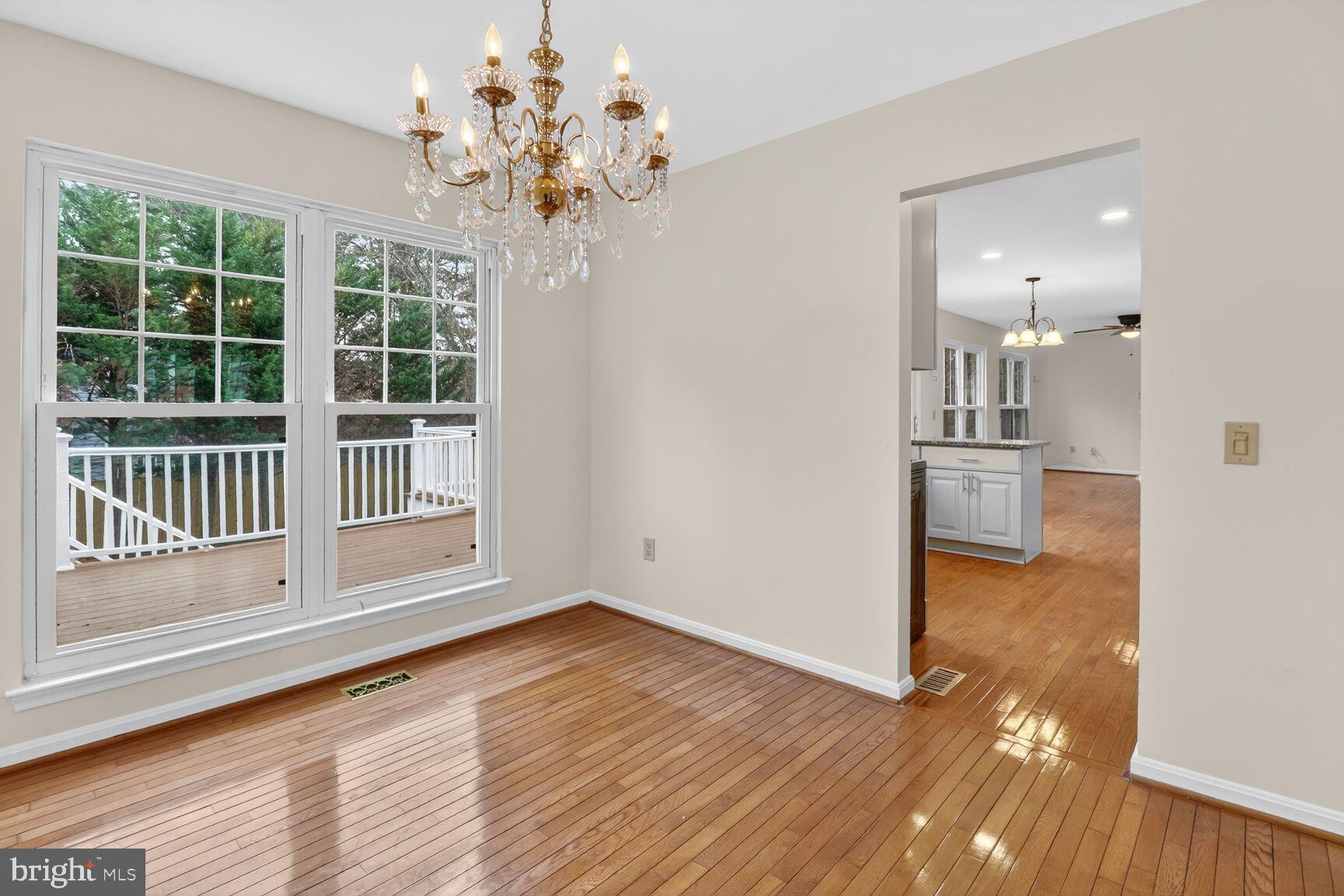 64 Foxwell Bend Road Glen Burnie, MD 21061 - Photo 5 of 38 Bright dining area with elegant chandelier.
