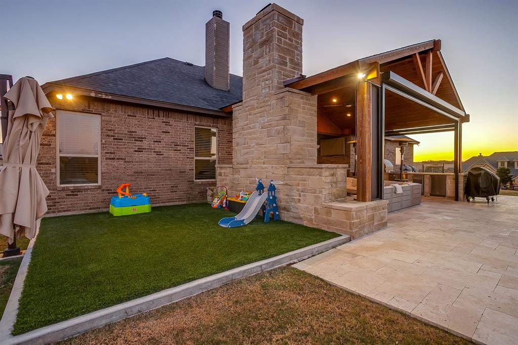 7320 Spring Ranch Court Godley, TX 76044 - Photo 34 of 38 a view of a house with backyard and sitting area