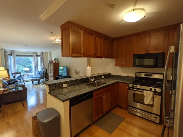 a kitchen with a stove sink and microwave