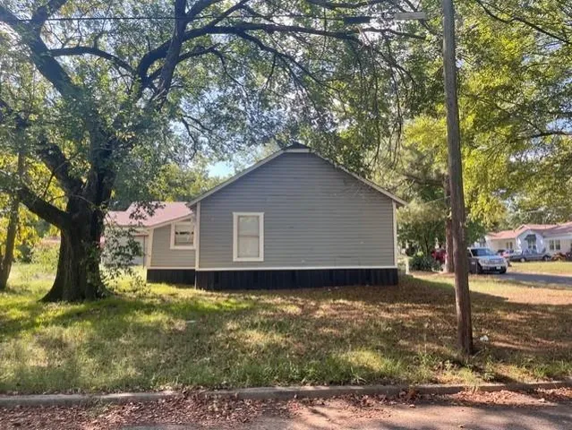 a house with trees in the background