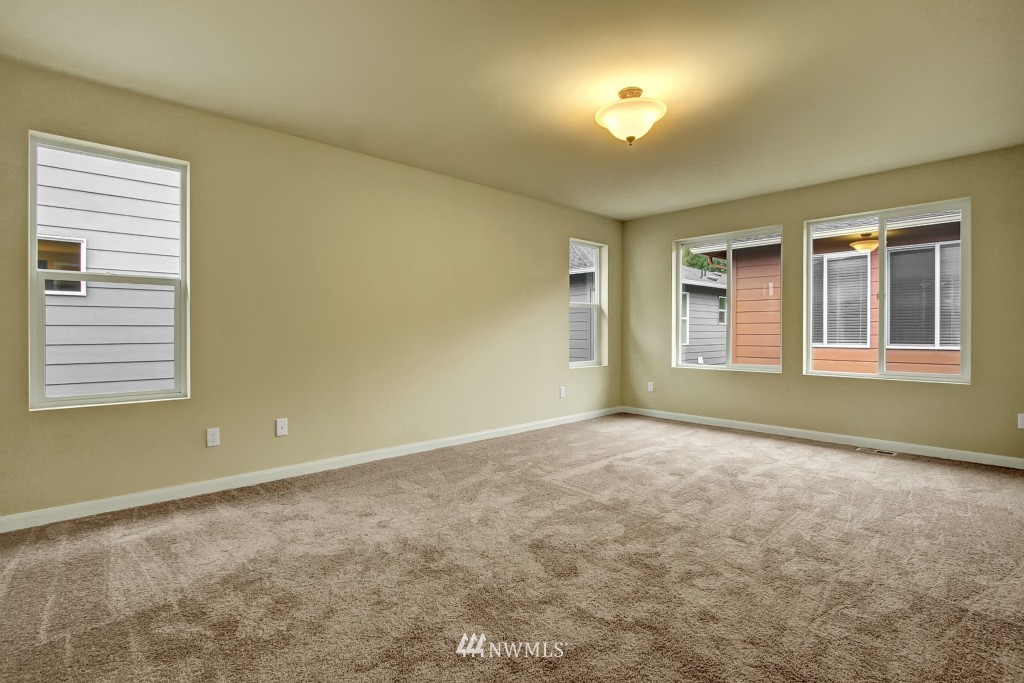 3609 177th Place Southeast, Unit 1015 Bothell, WA 98012 - Photo 6 of 14 a view of an empty room with a window