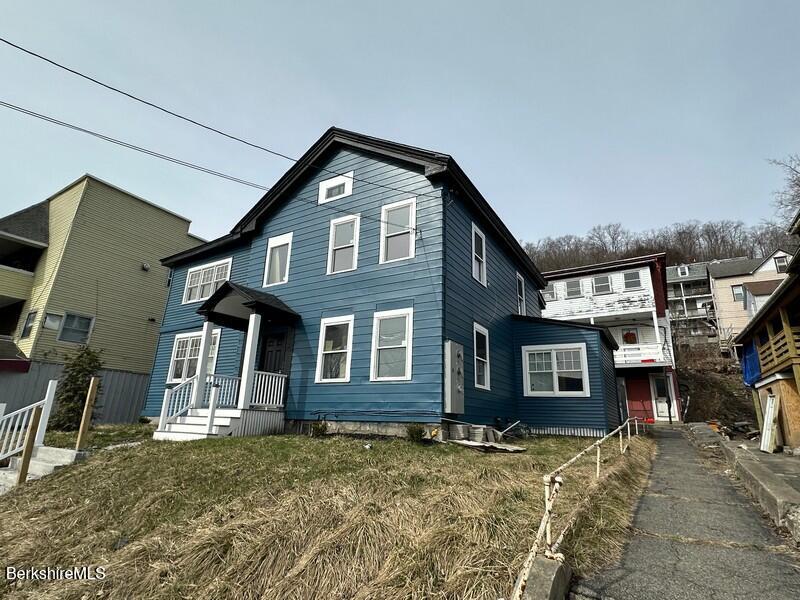 131 State Street North Adams, MA 01247 - Photo 2 of 32 a front view of a house with a yard