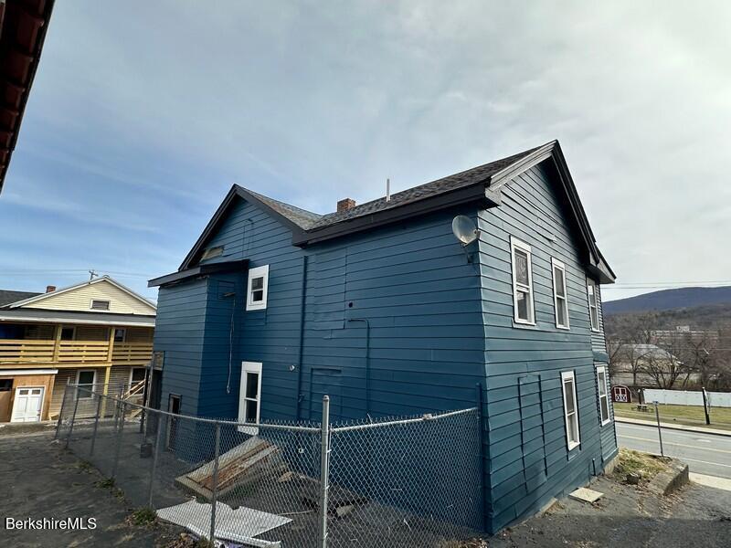 131 State Street North Adams, MA 01247 - Photo 5 of 32 a front view of a house with glass windows