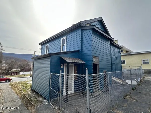 a front view of a house with a garage